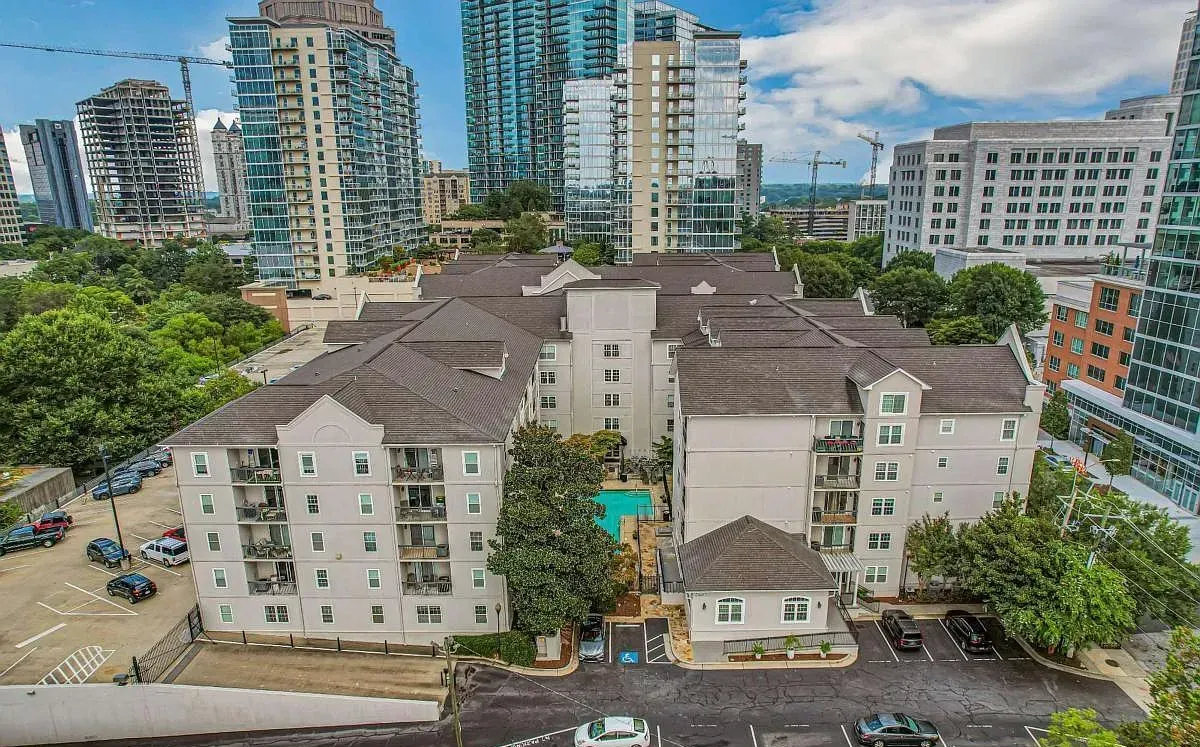 Aerial view of Peachtree Walk and its courtyard pool amid the Midtown skyline