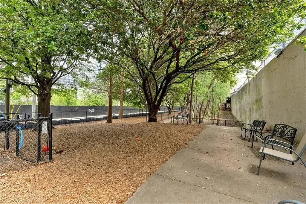 The gated, tree-shaded dog park — the largest secure dog run in Midtown