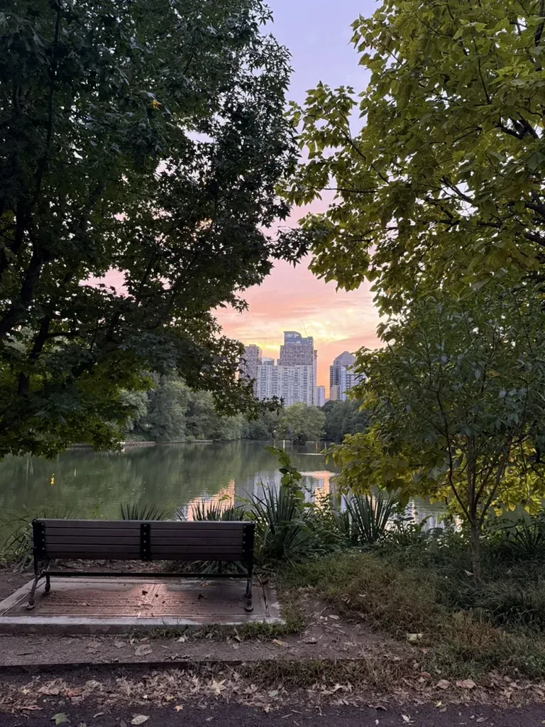 Golden-hour light over Piedmont Park and the Midtown skyline